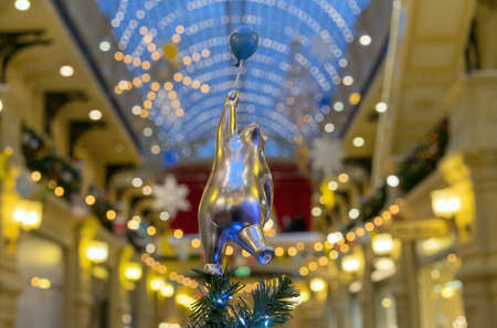 Polar bear with a balloon on the top of the Christmas tree.の写真素材