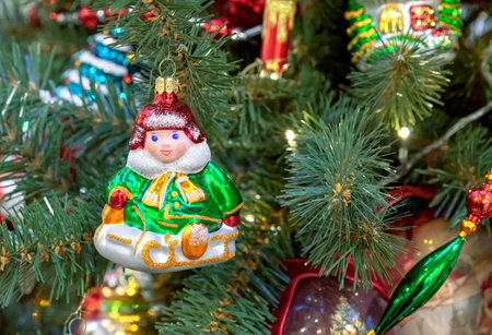 Boy on a sled is a vintage Christmas toy on a Christmas tree.の写真素材