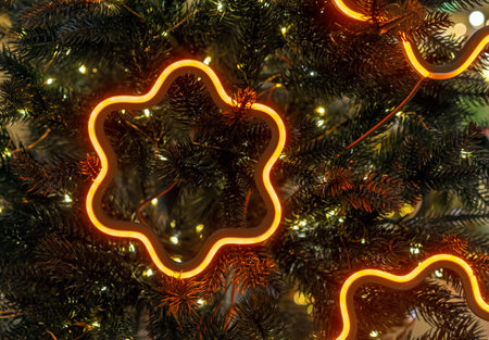 Orange LED Christmas decorations on a modern Christmas tree.の写真素材