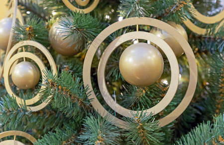 Christmas ball of gold-colored with rings. New Year decorations in space style.の写真素材