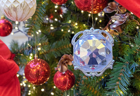 Christmas tree toy blue diamond on the Christmas tree with red Christmas balls and garland.の写真素材