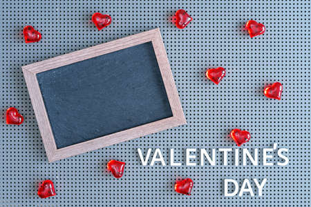 Red hearts with a rectangular frame for inscriptions. Valentine's day concept.