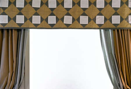 Yellow and gray curtains in the style patchwork on the living room window.の写真素材