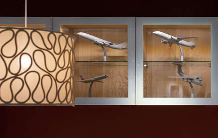 Aircraft models in a wooden shelf with glass doors.の写真素材