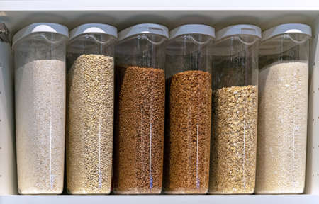Plastic containers with various cereals and grains. food storage concept.の写真素材