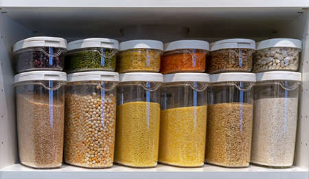 Plastic containers with various cereals and grains. food storage concept.の写真素材