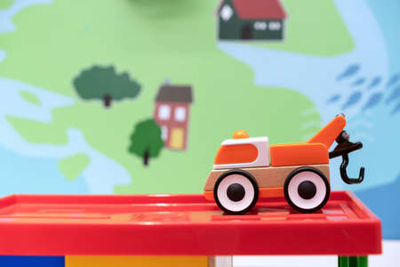 Children's wooden car with a hoisting crane. Eco-friendly children's toys.の写真素材