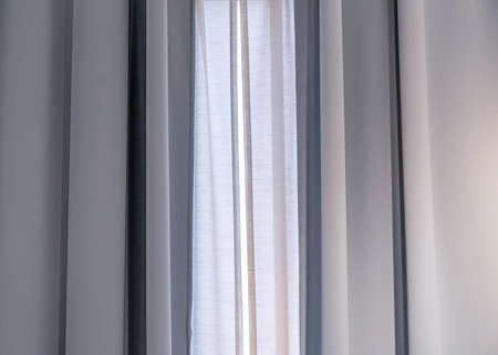 Gray blackout curtains on the living room window.