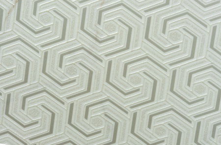 Light yellow ceramic tile with a three-dimensional pattern.