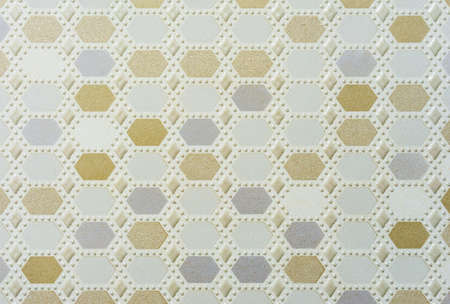 Ceramic tiles with yellow and blue geometric shapes and voluminous white dots.