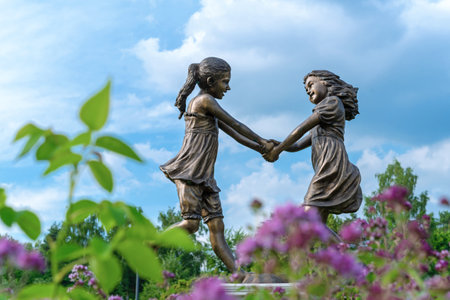 MOSCOW, RUSSIA - July 06, 2022: Bronze sculpture "Dancing girls" in the summer garden.のeditorial素材
