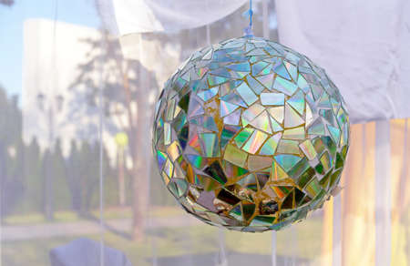 Disco ball from broken CDs for holidays and parties.の写真素材