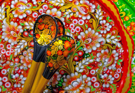 Wooden spoons with a bright pattern in the technique of Russian Khokhloma.の写真素材