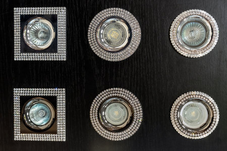 Ceiling lamps (spots) with rhinestones and LED bulbs. Concept of glamor and high technology in the interior.の写真素材
