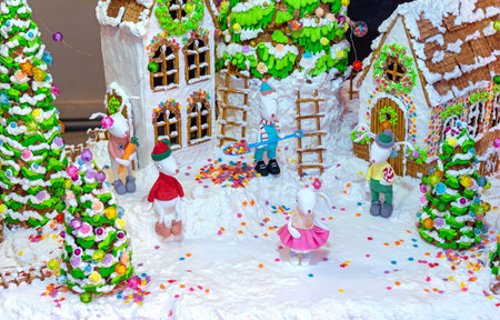Christmas cake with hares, houses and Christmas trees.