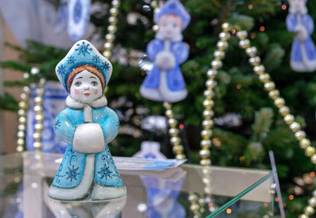 Porcelain figurine of the Snow Maiden in a fur coat with a fur coupling.の写真素材