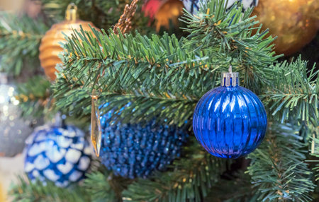 Dark blue faceted Christmas ball on Christmas tree. Christmas decor.の写真素材