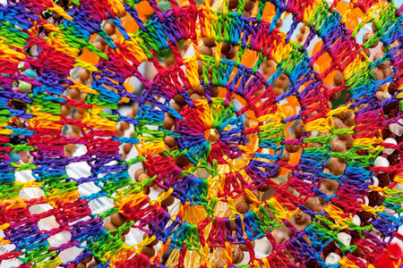 Knitted cobweb of multi-colored threads. Background of bright threads.