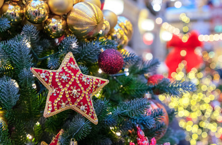 Red star with beads and sequins on a Christmas tree.の写真素材