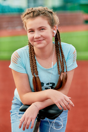 A young bright girl loves sports. Closeup portrait of a teenage girl.の写真素材