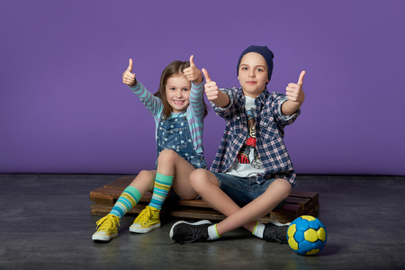 beautiful kids loves sports.friends of the children show a like thumbs up.の写真素材