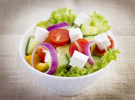 Greek salad on linen tableclothの写真素材