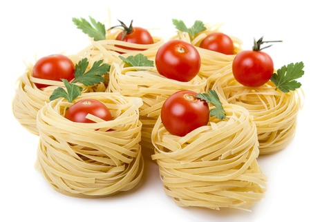 Raw italian pasta with cherry tomatoesの写真素材