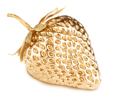 Gold strawberry isolated on whiteの写真素材
