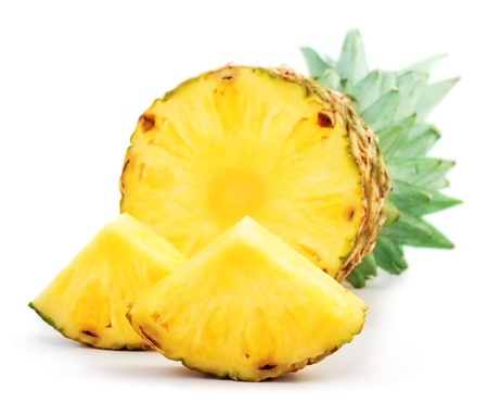 Pineapple with slices isolated on whiteの写真素材