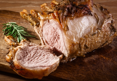 Grilled meat with rosemary on cutting boardの写真素材