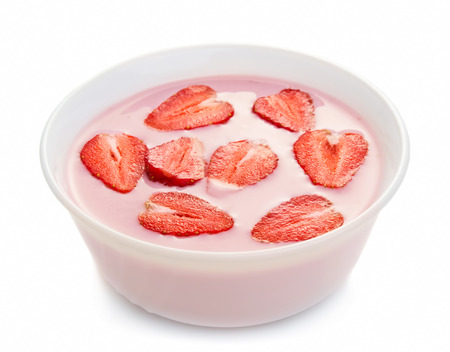 Yogurt with strawberries in bowl isolated on white backgroundの写真素材