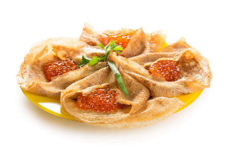 Pancakes with red caviar isolated on white backgroundの写真素材
