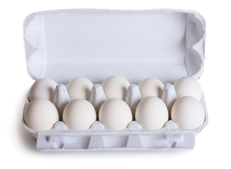 Fresh raw eggs in box isolated on white backgroundの写真素材