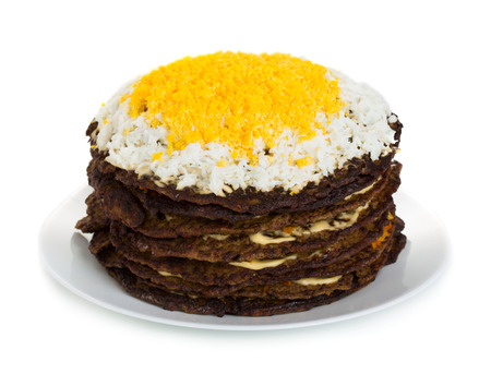 Cake made from liver pancakes on plate isolated on white backgroundの写真素材