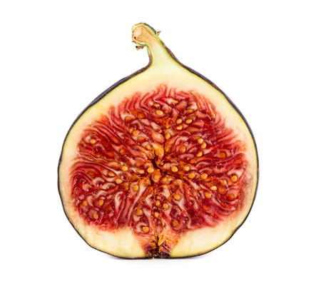 Slice of fresh ripe fig isolated on white backgroundの写真素材