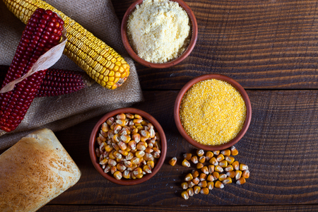 Corn cobs, seeds, groats, flour and bread , raw food conceptの写真素材