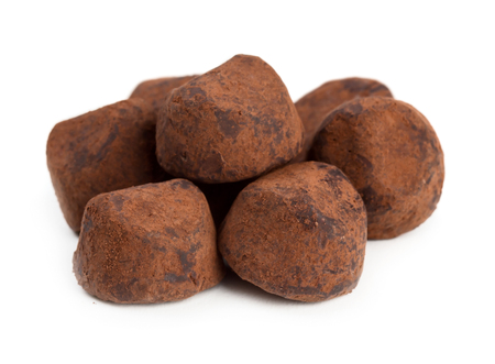Close up view of chocolate truffles isolated on white backgroundの写真素材