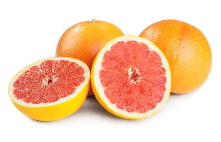 Grapefruits with slices isolated on white backgroundの写真素材