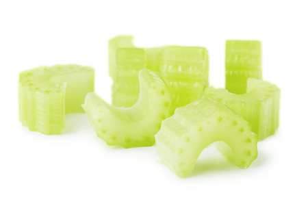 Fresh green celery slices isolated on white backgroundの写真素材