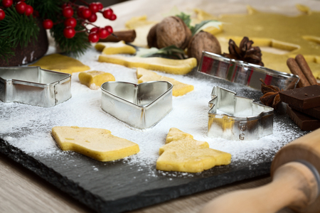 Christmas baking: ginger biscuit with holly berry decorationの写真素材