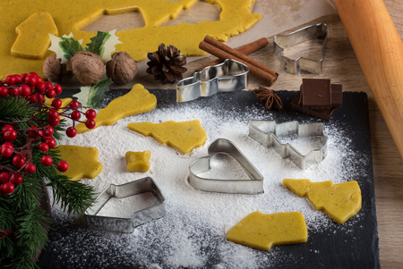 Christmas baking: ginger biscuit with holly berry decorationの写真素材