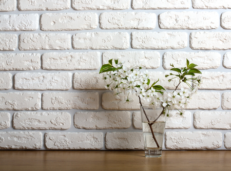 Cherry blossom brunch over textured brick wall backgroundの写真素材