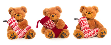Three Teddy bears with Christmas stocking isolated on white backgroundの写真素材