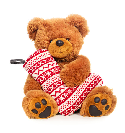 Teddy bear with Christmas stocking isolated on white backgroundの写真素材