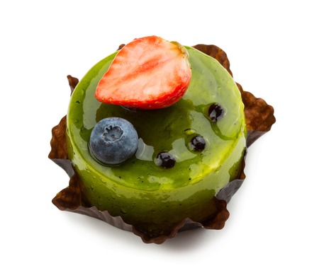 Sweet jelly cake with raspberries and blueberry isolated on white backgroundの写真素材