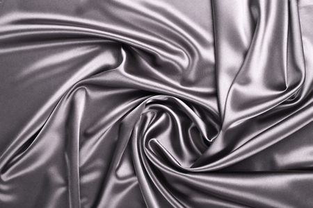 Smooth elegant silver silk or satin texture can use as abstract background. Luxurious background designの写真素材