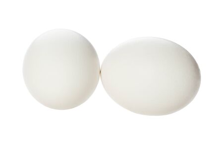 Two raw fresh eggs isolated on white backgroundの写真素材