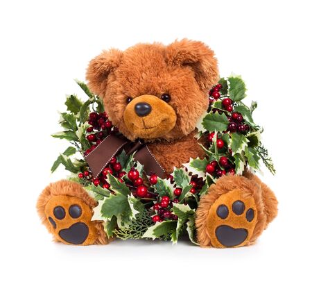 Teddy bear with Christmas wreath isolated on white backgroundの写真素材