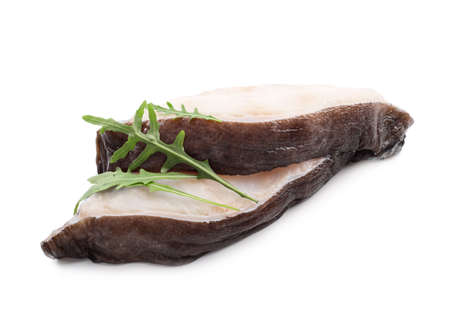 Two fish steaks with arugula leaves isolated on white backgroundの写真素材
