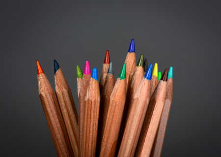 Colored pencils on dark backgroundの写真素材
